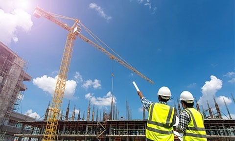 Construction workers and crain